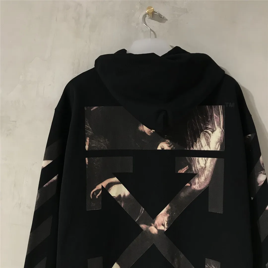 Top tested version OFF WHITE OW Certified Angel Wings Madonna Religious Oil Painting Men's and Women's Round Neck Zipper Cardigan Sweater The A mark on the neckline is a 3M reflective mark, customized model, not an embroidery mark, first look for identification.  The Renaissance-themed Caravaggio Madonna oil painting is inspired by one of Caravaggio's famous oil paintings, with a strong religious color! World treasures, top-notch paintings, and walking art pieces follow the original craftsmanship and use 5-color glue to create an effect. It is not offset printing, but many people on the market use Kornit direct inkjet instead. Whether it is the top version, touch the printing with your hand. The correct process is that it has a frosted feel. This is also a way to identify the uniqueness of the product. The fabric is 100% combed cotton terry fabric, 480 grams, ensuring the originality of the craftsmanship! Secondly, the tag rope of this model hangs from the collar tag, not the side rope. Customized auxiliary materials, complete accessories, consistent zp, hang tags, collar labels, and washed labels, feel free to compare!   Color: Black White Size Chart
